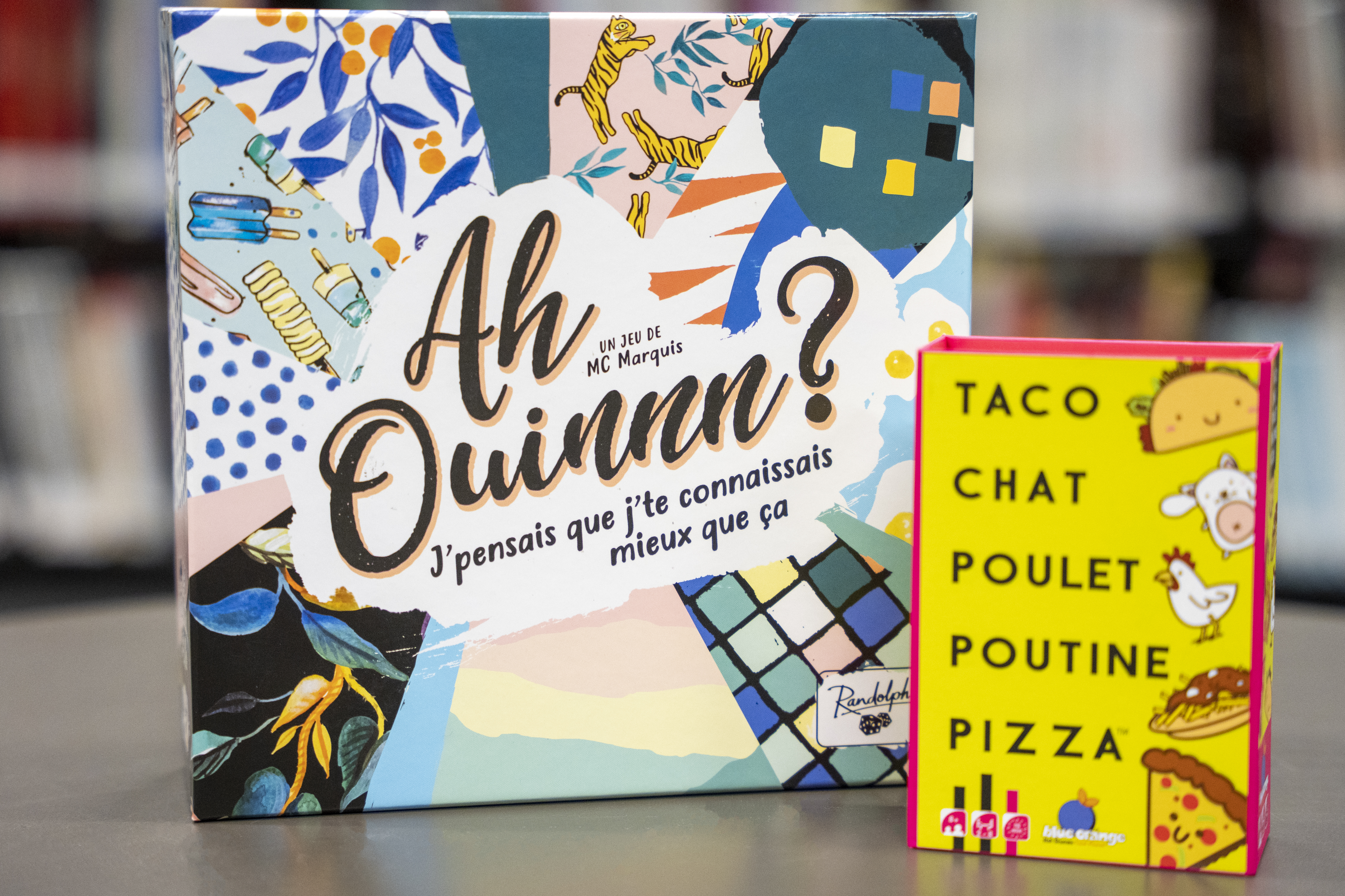 Boîtes des jeux Ah ouinnn? et Taco chat poulet poutine pizza.