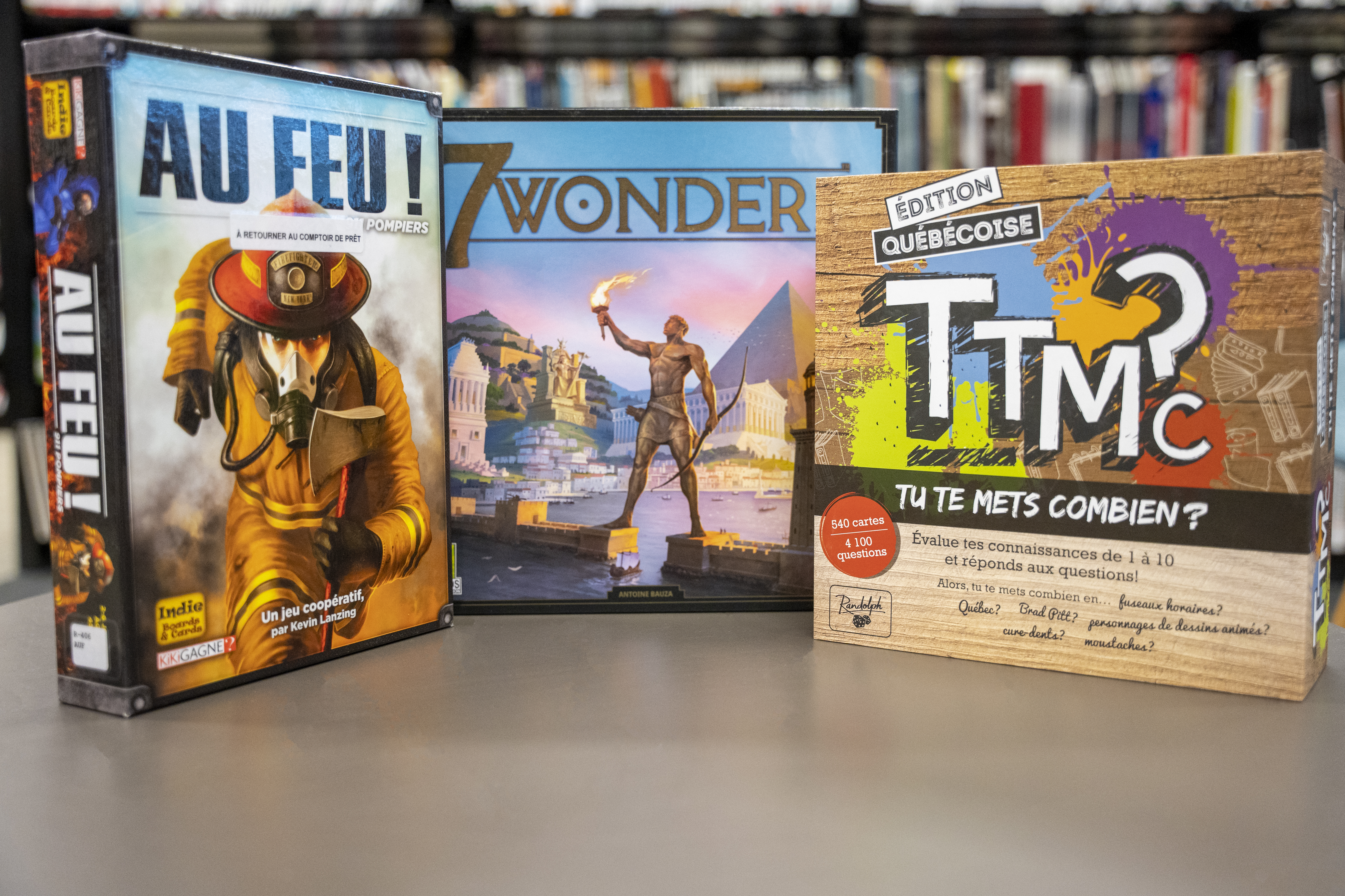 Les boîtes des jeux Au feu!, 7 Wonders et TTMC.